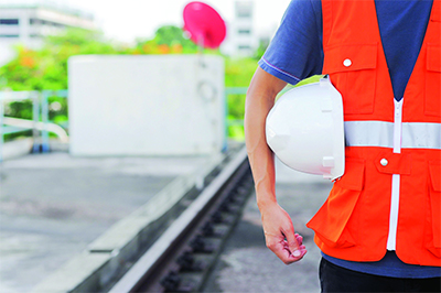 Worker holding hard hat